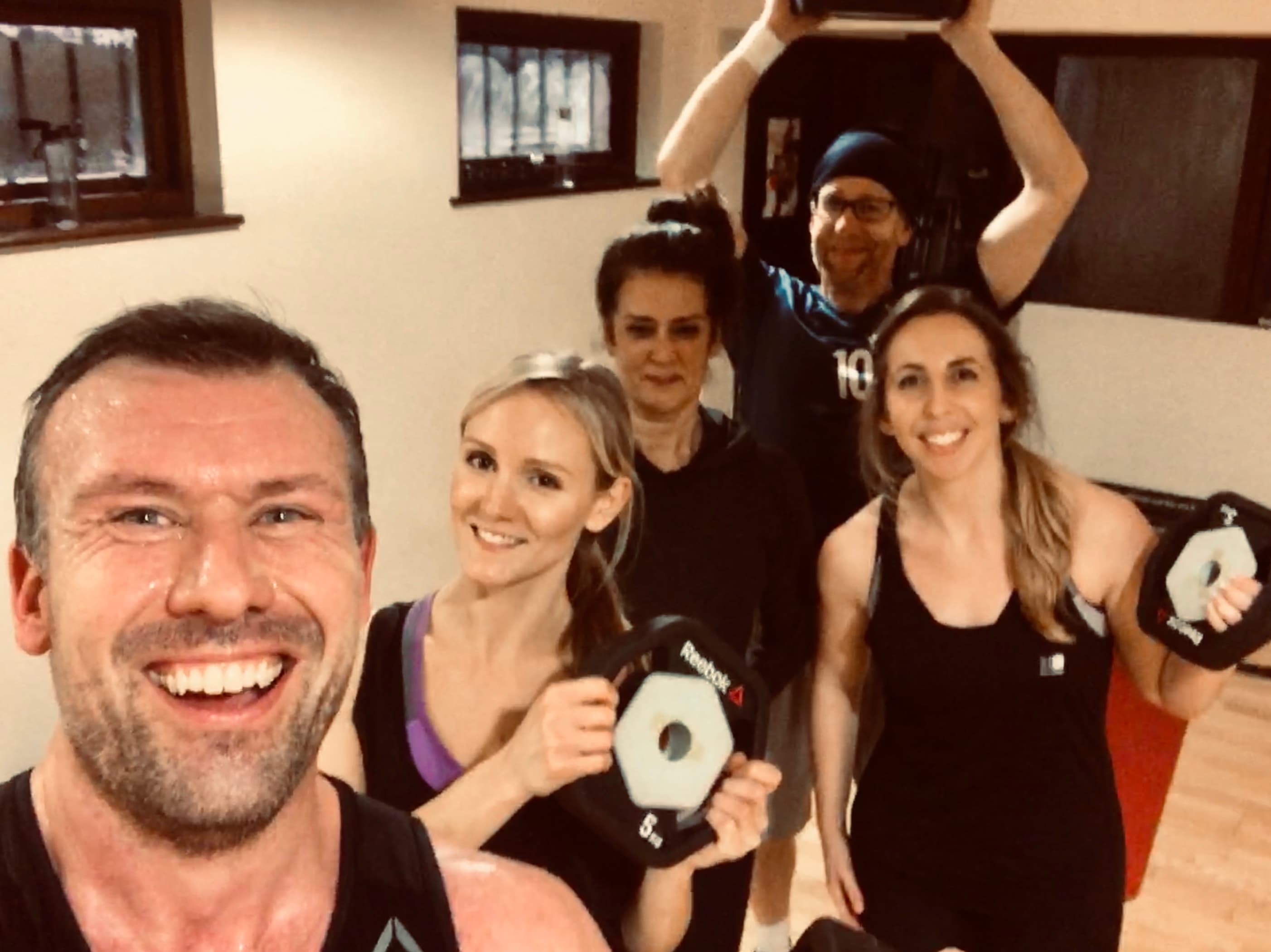 Group fitness session at BodyPump class in Tooting, demonstrating community engagement and dedication to maintaining an active lifestyle in London