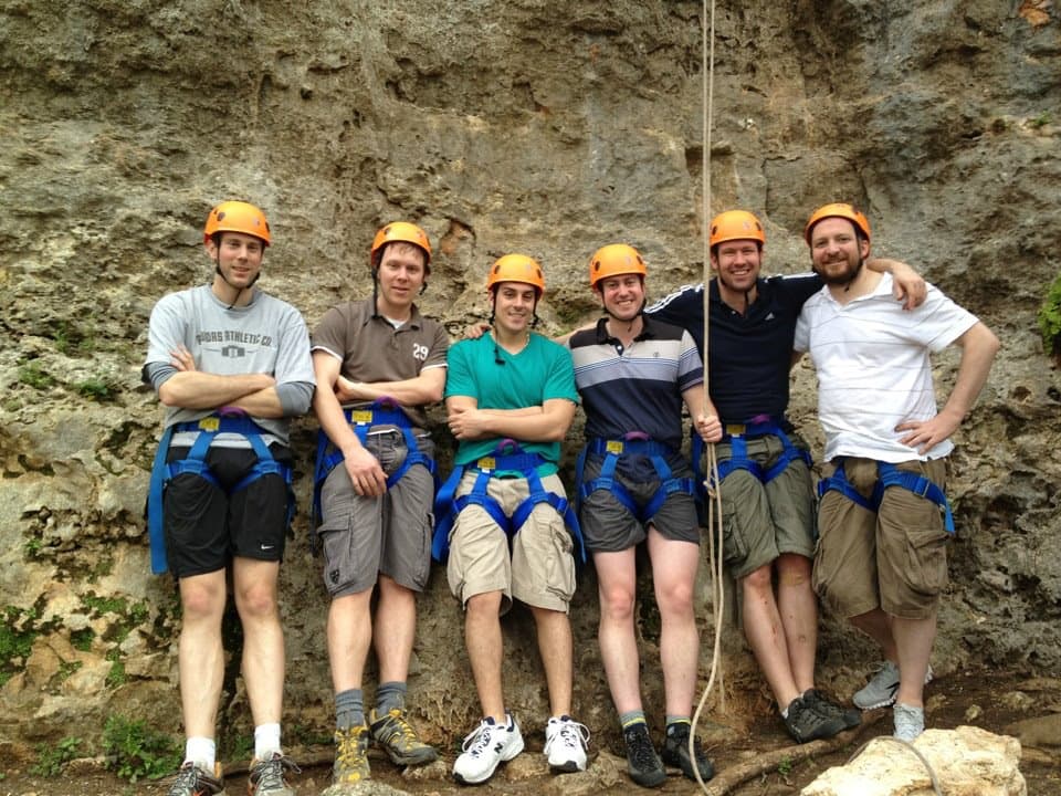 Adventure sport moment capturing the thrill and challenge of rock climbing, demonstrating technical skill, strength, and overcoming vertical challenges