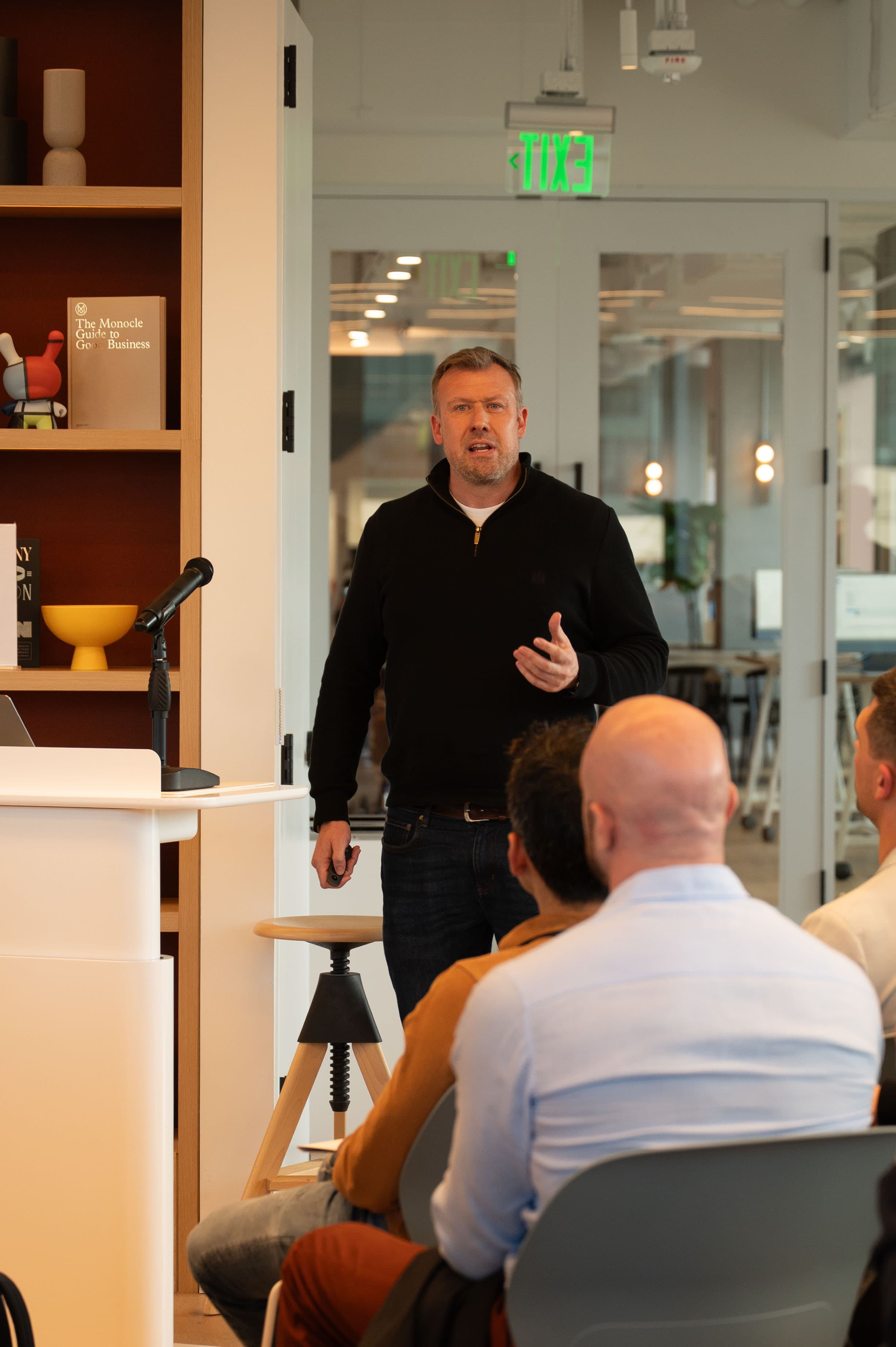 Speaking engagement at Young Presidents' Organization event, delivering a presentation to fellow business leaders and entrepreneurs