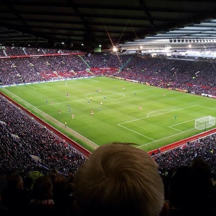 Father at the iconic Old Trafford stadium, home of Manchester United, enjoying the legendary atmosphere of the Theatre of Dreams